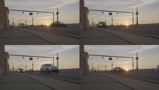 通勤者开车经过太阳升起的高清桥高清在线视频素材下载