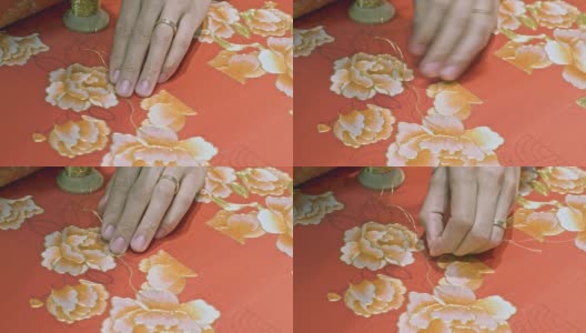 近距离的中国工匠刺绣一件婚纱高清在线视频素材下载