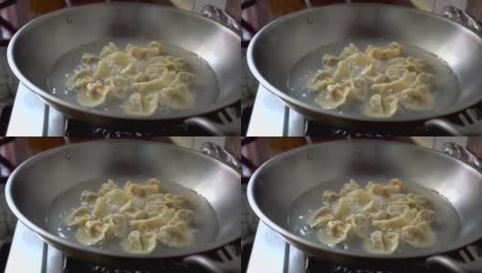 饺子是用平底锅里的沸水煮的。高清在线视频素材下载
