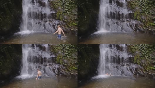 厄瓜多尔马什皮云森林的木兰瀑布上，一名男子正在洗澡。中枪高清在线视频素材下载