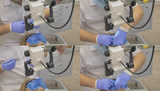 医生使用显微镜。牙医在现代牙科诊所里治疗病人。牙齿矫正师与助手一起工作。作业采用围堰进行。医生和助手戴着防护口罩工作。高清在线视频素材下载