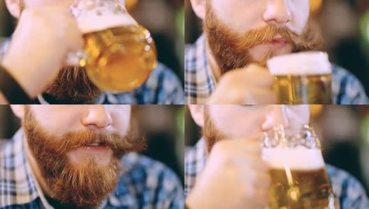 胡子男在酒吧里喝啤酒高清在线视频素材下载