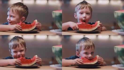 可爱的小男孩看着镜头，吃着西瓜，笑着。快乐男捧着一片，欢呼着高清在线视频素材下载