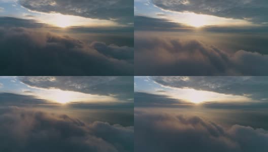 在日出时，在浓重的灰色乌云中向前飞行。空中延时运动。无人机hyperlapse。高清在线视频素材下载