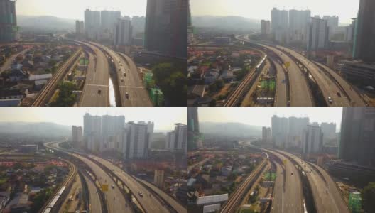 鸟瞰图吉隆坡市区，马来西亚和高速公路。亚洲智慧城市的金融区和商业中心。摩天大楼和高楼大厦中午与蓝天。高清在线视频素材下载