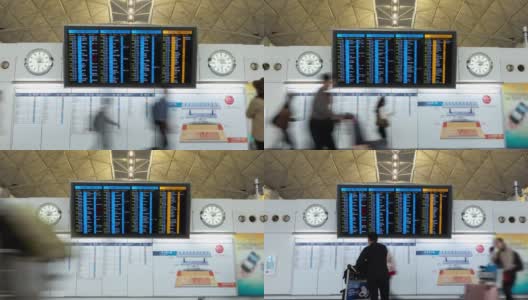 4K时光流逝:旅客及游客查询香港机场内的航班时间表高清在线视频素材下载