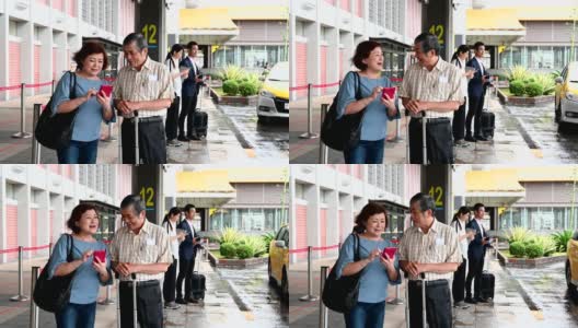 Senior couple waiting outside airport高清在线视频素材下载