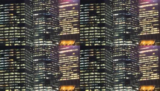 现代办公摩天大楼和夜间玻璃窗高清在线视频素材下载