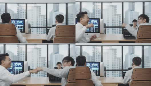 4K UHD:两个亚洲商人官员感到高兴和手碰撞在现代办公室。高清在线视频素材下载