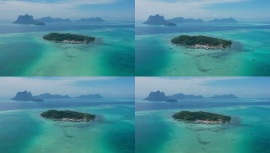鸟瞰图美丽的岛屿背景与惊人的蓝色海洋和珊瑚礁作为旅游目的地位于森本那，沙巴州，马来西亚，婆罗洲。高清在线视频素材下载