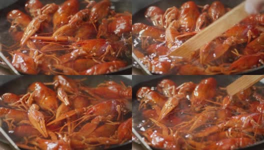 红色的小龙虾在平底锅里煮。高清在线视频素材下载
