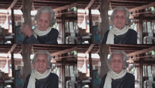 亚洲老年妇女的肖像，年长妇女与短灰色头发看着相机，老年妇女的概念。高清在线视频素材下载