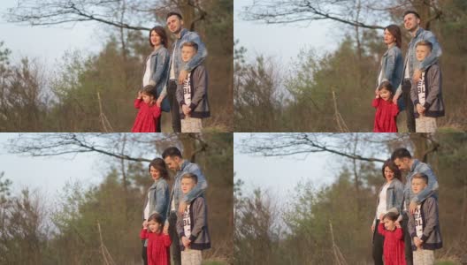 幸福的一家人在树林里度假。温暖的春天天高清在线视频素材下载