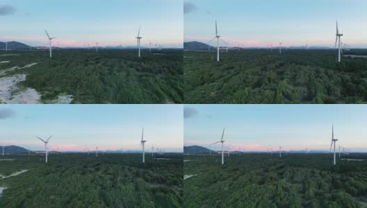 风电场的景色在暮色中与森林和谐相处高清在线视频素材下载