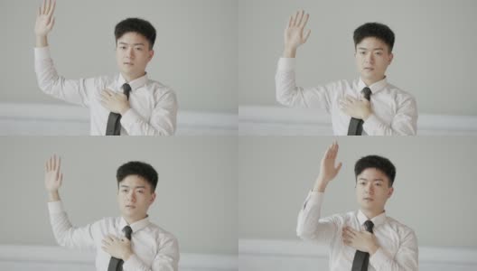 年轻的亚洲男性白领在办公室里锻炼身体。简单的办公室运动有助于恢复精力高清在线视频素材下载