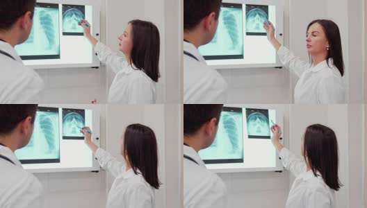 女医生用铅笔在人的头部x光片上点了一下高清在线视频素材下载