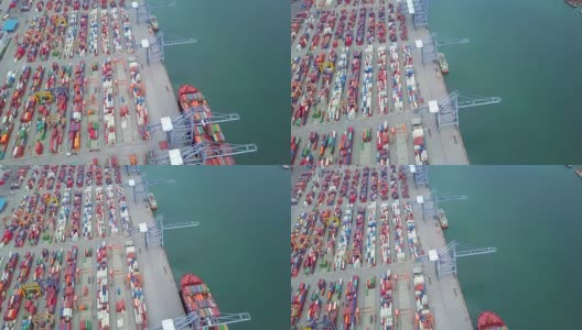 鸟瞰港口集装箱码头集装箱船的进出口及业务物流高清在线视频素材下载