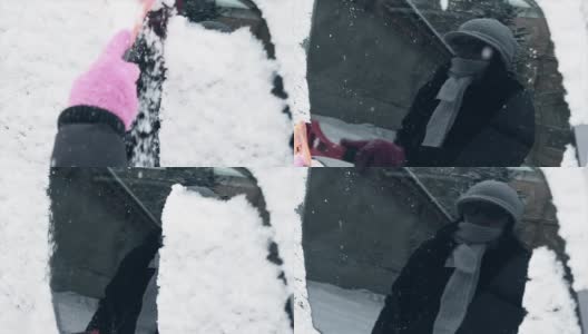 冬天，女人们手戴粉色手套清除汽车挡风玻璃上的积雪高清在线视频素材下载