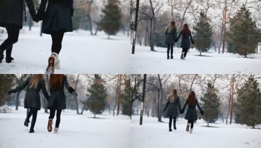 雪中两个美丽的女人高清在线视频素材下载