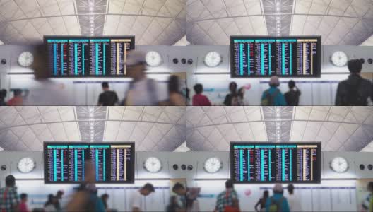 航班信息板国际机场的人们正在检查他们的航班。高清在线视频素材下载