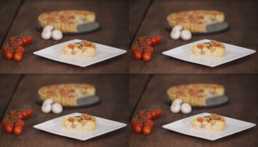 洛林鸡乳蛋饼配蘑菇、番茄和芝士。法国菜高清在线视频素材下载