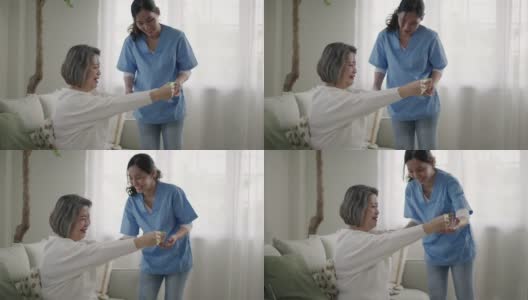 帮助老年妇女改善行动能力的理疗师高清在线视频素材下载