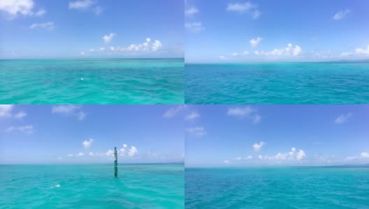在日本冲绳的一个偏远岛屿上，乘坐渡船穿过蓝色的大海高清在线视频素材下载