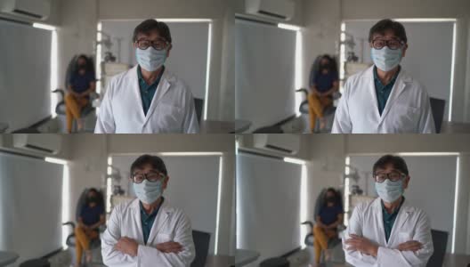 一名眼科医生的肖像在医疗诊所-戴防护口罩高清在线视频素材下载