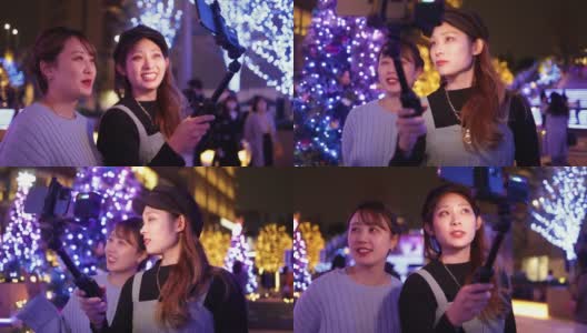 年轻女性朋友在圣诞节的灯光下自拍电影-第二部分的第一部分高清在线视频素材下载