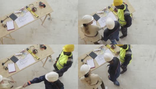 一群建筑师在施工现场修改施工计划高清在线视频素材下载