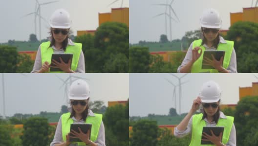 女工程师在港口集装箱使用数字平板电脑高清在线视频素材下载
