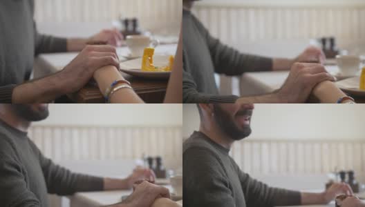 年轻夫妇手牵着手在咖啡馆里享受甜点高清在线视频素材下载