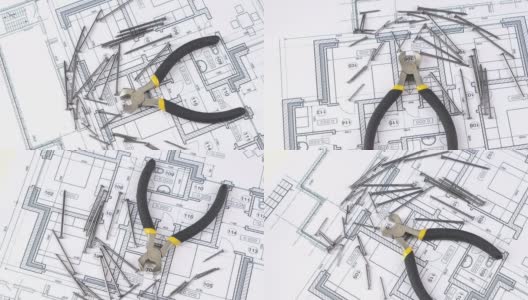 用黄、灰手柄的钢丝切割器切割建筑平面、方案、钉间、旋转高清在线视频素材下载