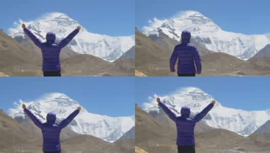 近距离观察:登山者在观察珠穆朗玛峰时成功地伸出双臂。高清在线视频素材下载
