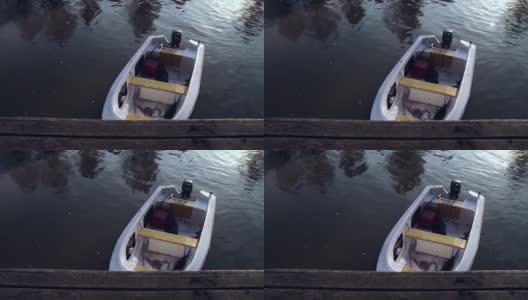湖码头上的小船。放大。高清在线视频素材下载