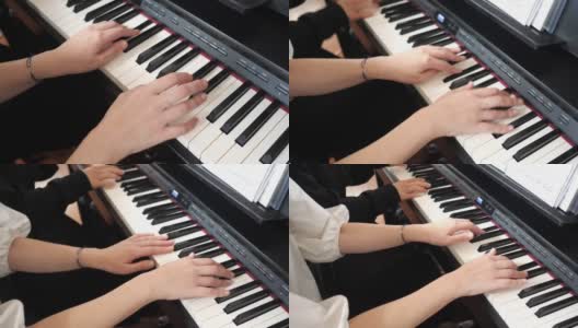 女性朋友一起弹钢琴高清在线视频素材下载
