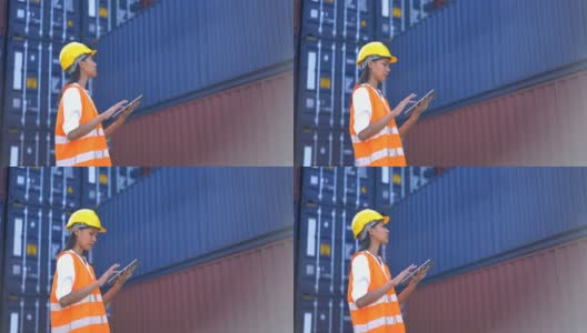 4K女工程师在航运港口使用数字平板电脑处理货运集装箱高清在线视频素材下载