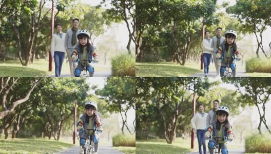 亚洲小女孩在户外骑自行车高清在线视频素材下载