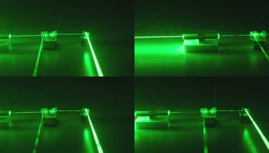 连续波绿色激光通过光学元件传播。高清在线视频素材下载