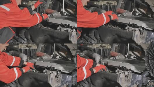 汽车修理工检查卡车发动机的油位高清在线视频素材下载
