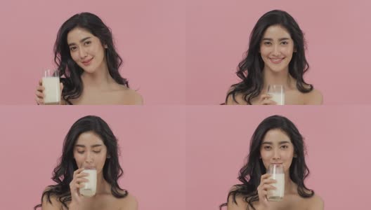 迷人的亚洲女人喝牛奶。高清在线视频素材下载