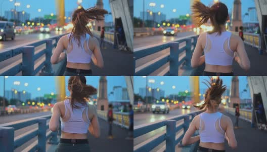 年轻女子慢跑过桥的慢镜头，暮光高清在线视频素材下载