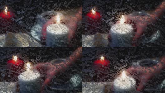 咖啡和蜡烛穿过暴风雪高清在线视频素材下载