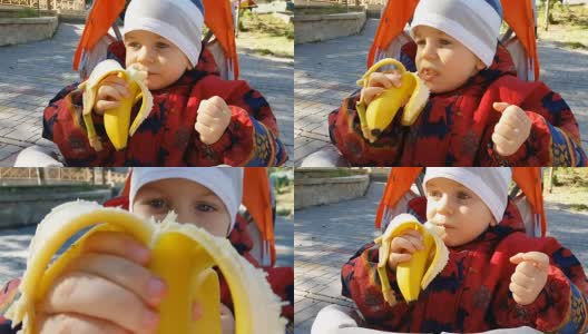 宝宝在公园吃香蕉高清在线视频素材下载