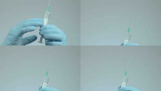 手从注射器中取出气泡，流感季节，接种疫苗，特写高清在线视频素材下载