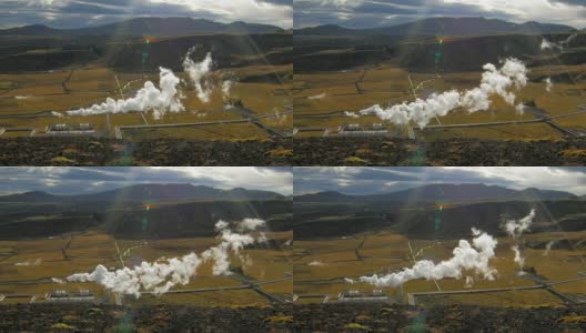 冰岛山谷景观与山脉和地热发电厂与蒸汽在阳光明媚的秋天高清在线视频素材下载