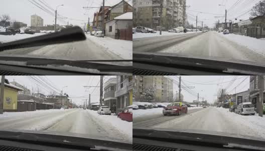 一场大雪过后，汽车载着雪行驶在城市道路上高清在线视频素材下载