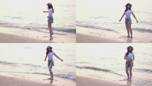慢动作的女人享受在海边的海滩高清在线视频素材下载