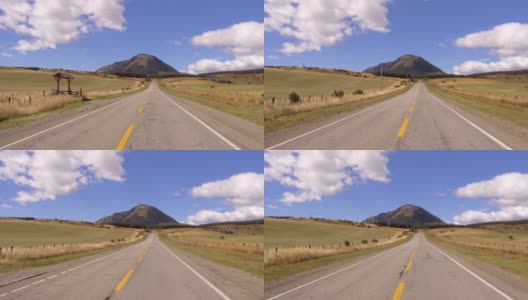 驱动板。乡村公路上的汽车，山脉，山谷- POV -视角前-挡风玻璃。的一天。高清在线视频素材下载