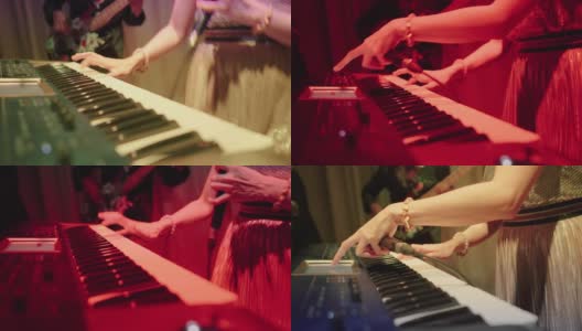 近距离的音乐家手弹钢琴在晚上高清在线视频素材下载